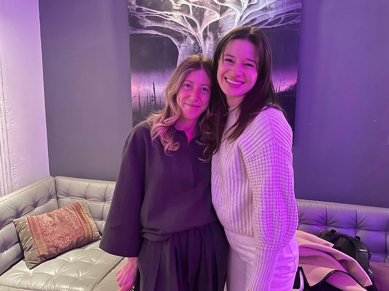 Two women smiling together at Unarthodox art event